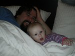 Playing on the bed with Daddy.